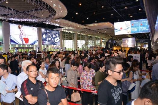 The crowds wait to enter the Bangkok Gem & Jewelry fair on the first day.