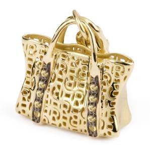 The popularity of charms continues unabated. Shown here: a gold and gemstone handbag charm by Rosato.