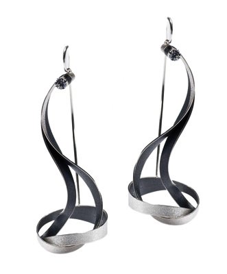 Freeform silver earrings by Arek Wolski, an innovative designer who says he used to work in amber but now prefers metal.