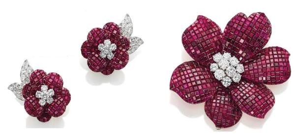 Mystery-set ruby and diamond flower brooch (US0,000-250-000) and pair of ear clips (US0,000-150,000), both by Van Cleef & Arpels