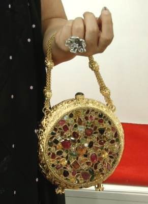 A 14K gold and gemstone clutch by CVM Jewellery