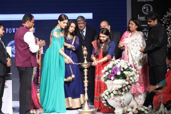 Sonam Kapoor and Anar Patel lighting the lamp during the inauguration