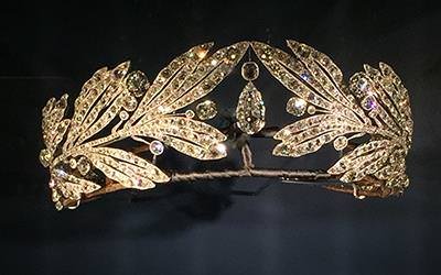 Laurel leaf tiara: Cartier Paris, special order, 1907. Platinum and diamonds. For her wedding to Prince George of Greece and Denmark, Princess Marie Bonaparte (grandniece of Napoleon Bonaparte) ordered jewels from Cartier. The wreathlike form of this tiara recalls the Roman imperial style popular at Napoleon's court. 