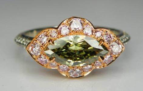 Ring made with a rare green chameleon diamond and white diamonds set in platinum and 18K gold by Maidi Corp (Centurion).
