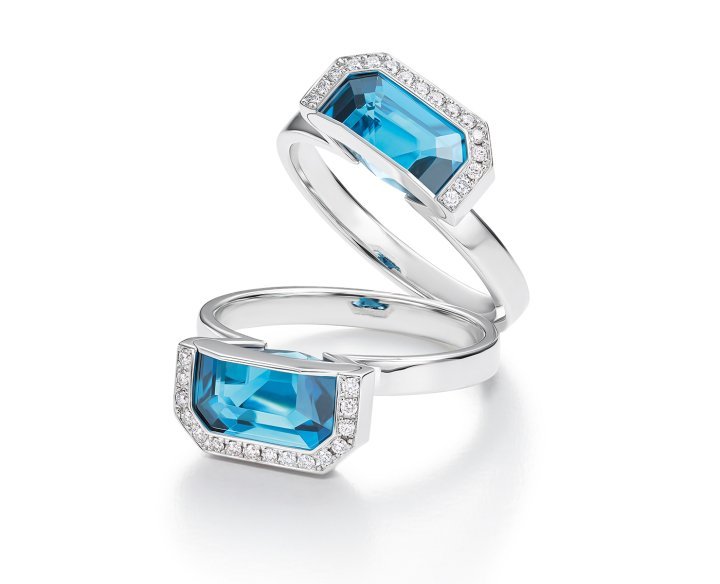The Arche ring features a vibrant duck-egg blue emerald-cut 5.76ct topaz “cut” into two symmetrical parts, set with 36 brilliant-cut diamonds in an arch-shaped mount made of 18K white gold.