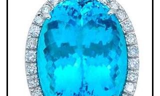 Vianna Brasil showcased a very rare certified 24.69-carat oval Paraiba tourmaline