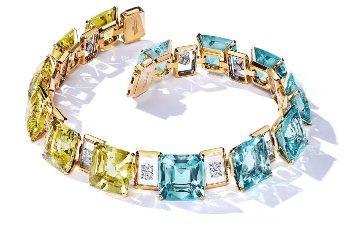 Necklace showcasing over 139 total carats of aquamarines and over 121 total carats of yellow beryls, more than 9 carats of diamonds appear suspended in midair on a setting that reveals, on closer examination, planes of rock crystal encased in 18k yellow gold frames