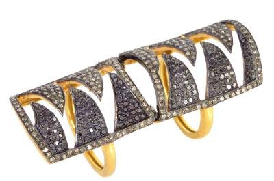 Edgy knuckle ring in diamonds and gold by Meghna.