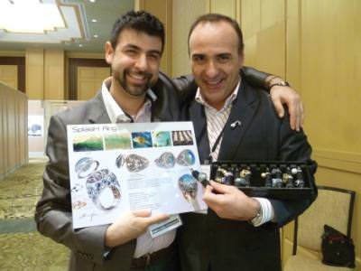 Centurion Emerging Designer winner, Alessio Boschi, left, and business partner, Martino Eduardo Convertino, hold a diagram detailing one of Alessio's complicated pieces of fine jewellery, and a tray of rings.