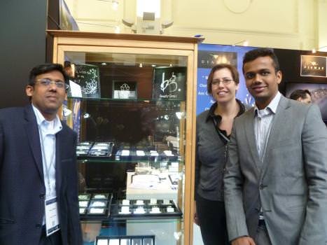 The most creative logo and diamond-studded promotional decorations were found at the Beauty Gems booth. From left to right are Nirav Shah, Liesbeth Cleen, and Sahil Shah.