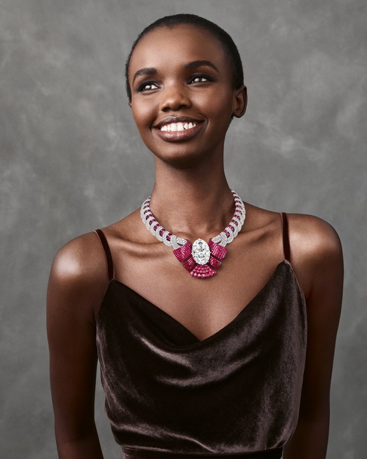 Atours Mystérieux transformable necklace in white gold and rose gold, set with a 79.35-carat, D-FL Type IIa oval diamond, the largest stone cut from the Lesotho Legend. It sits at the centre of a double ribbon of Mystery Set rubies.