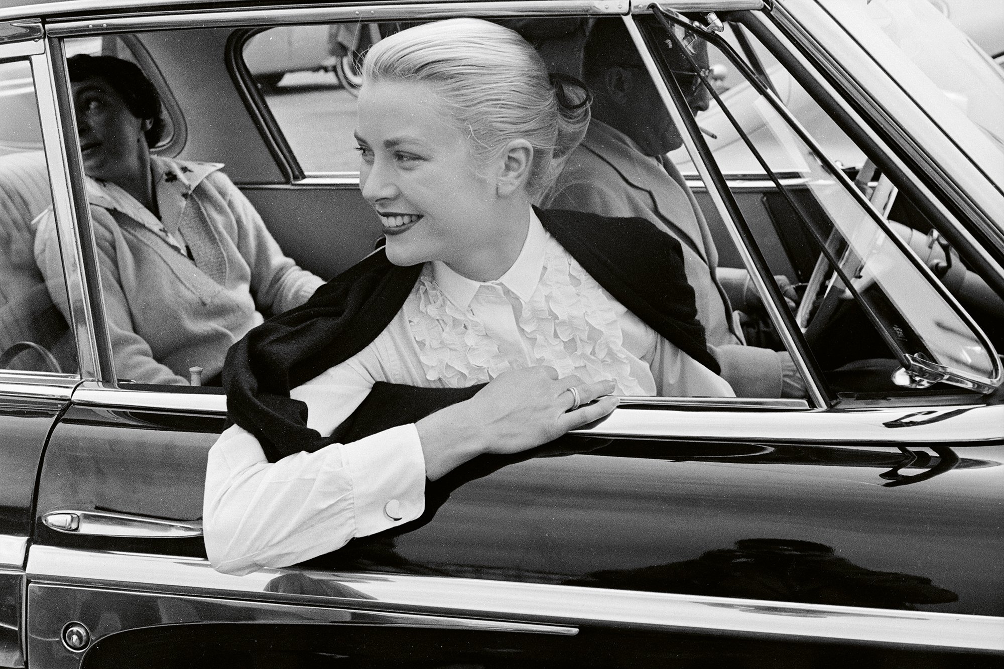 Grace Kelly wearing her Trinity ring. Cannes Film Festival, 1955. ©Edward Quinn Courtesy of Cartier