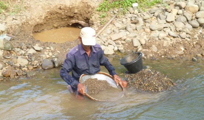 A river-bed miner looks for sapphires and other gems near Pailin, Cambodia.