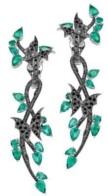 Emerald and black diamond earrings in the “Fly by Night” line by Stephen Webster.