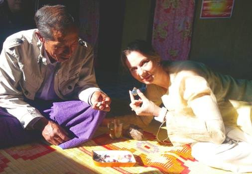 Elke Berr examines gemstones during a recent trip to Myanmar